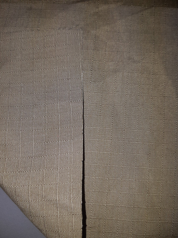 YARD ⚜  
10007-143 ⚜  
D1 ⚜  
PANTONE: No pantone color assigned ⚜  
ripstop fabric C, 65 %polyester 35 % cotton, dark beige